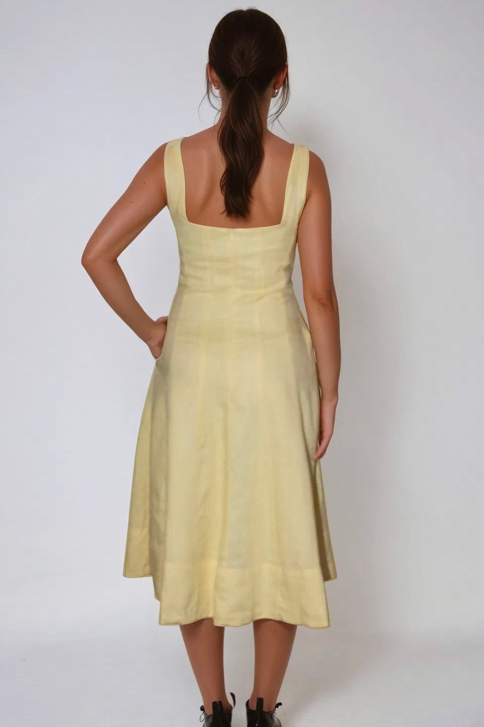100% recycled linen and lined with soft recycled polyester, A-line midi silhouette and elegant panelling